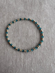 Gold Bead Bracelet with Blue Topaz accents