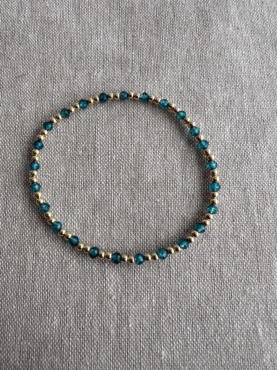 Gold Bead Bracelet with Blue Topaz accents