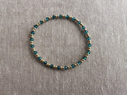 Gold Bead Bracelet with Blue Topaz accents