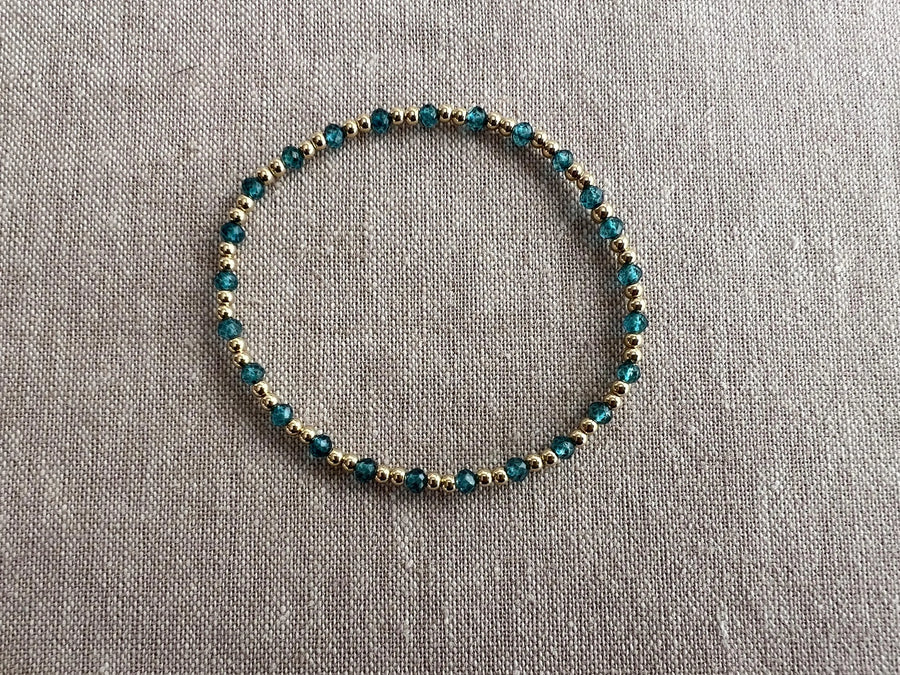 Gold Bead Bracelet with Blue Topaz accents