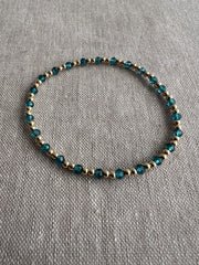 Gold Bead Bracelet with Blue Topaz accents