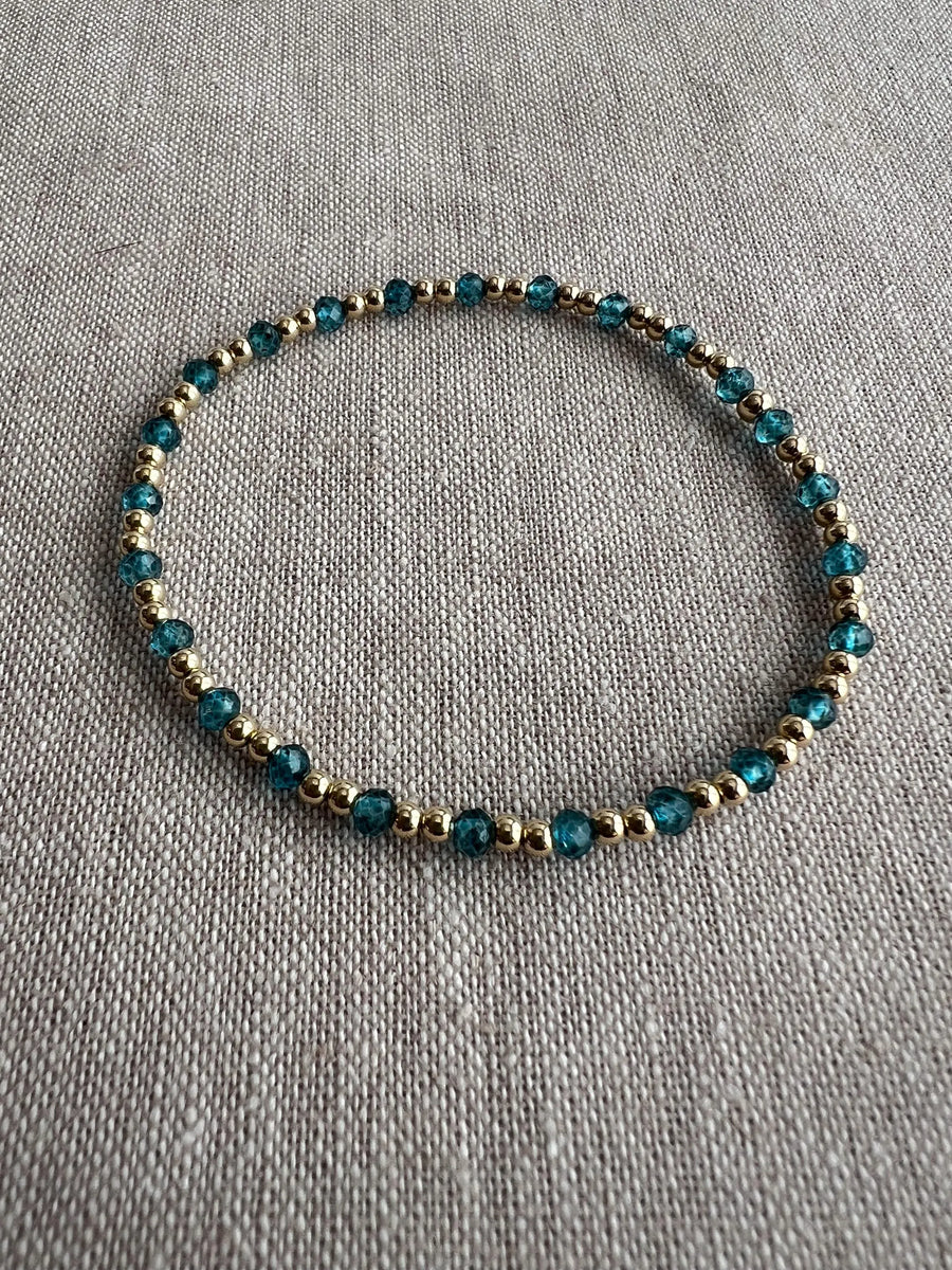 Gold Bead Bracelet with Blue Topaz accents