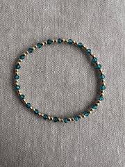 Gold Bead Bracelet with Blue Topaz accents