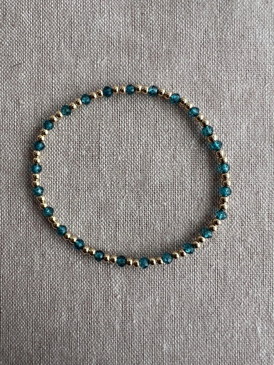 Gold Bead Bracelet with Blue Topaz accents