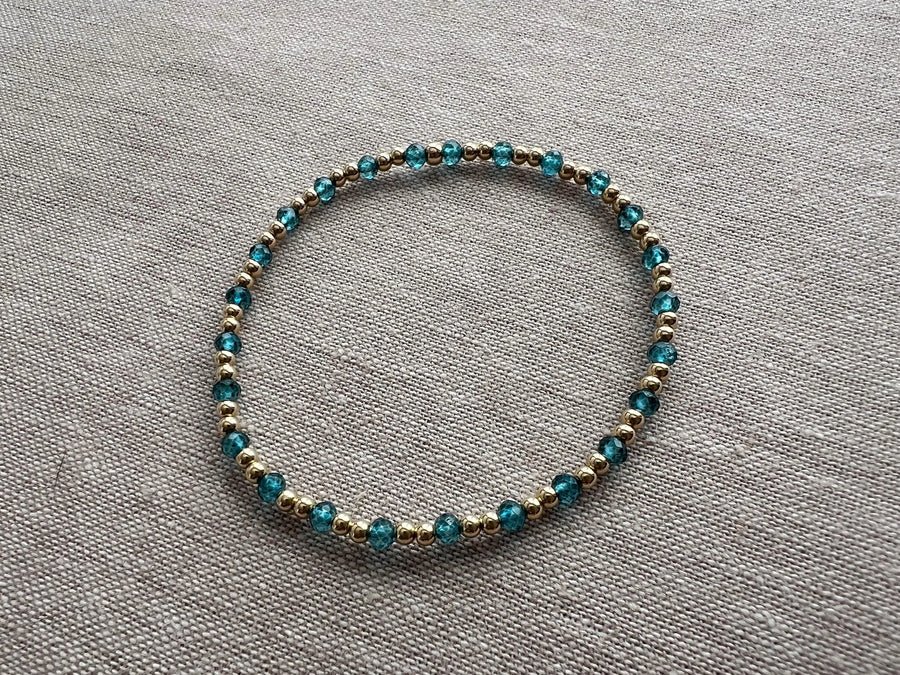 Gold Bead Bracelet with Blue Topaz accents