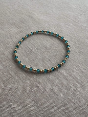 Gold Bead Bracelet with Blue Topaz accents