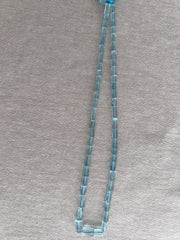 AA+ Aquamarine faceted cylinder beads in consistent light blue shades, ideal for handmade necklaces and fine gemstone jewelry.