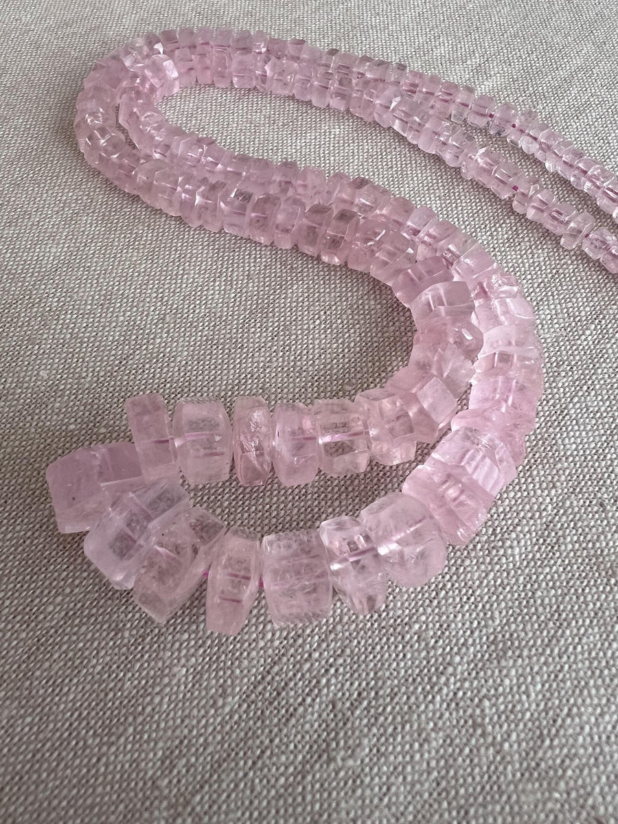 Brazilian Pink Morganite faceted cylinder and bolt-shaped beads featuring rich pink tones, translucent clarity, and polished facets.