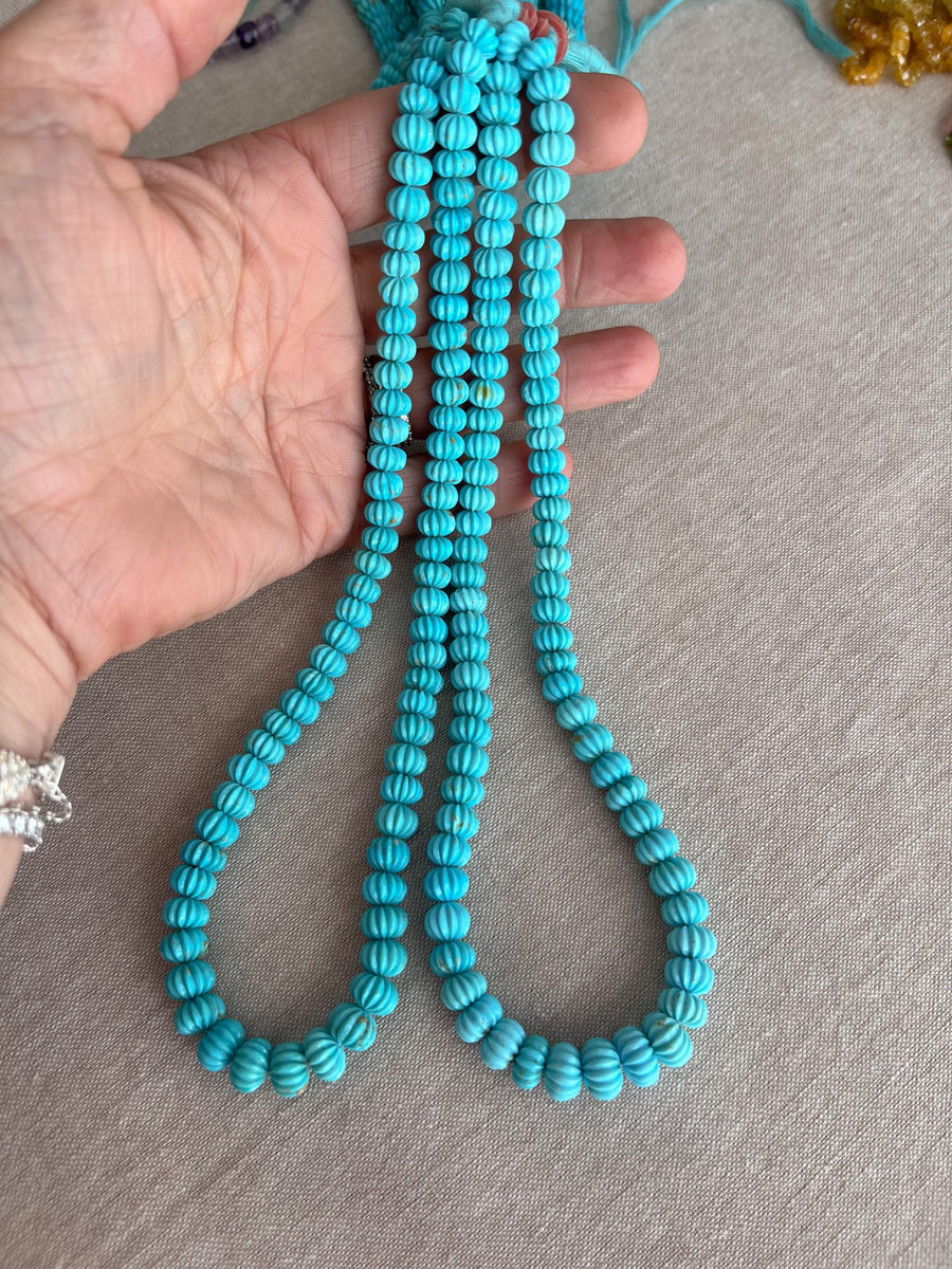 16-inch strand of AA+ Arizona Sleeping Beauty Turquoise carved melon beads, graduated from 5.5mm to 9mm for jewelry making.