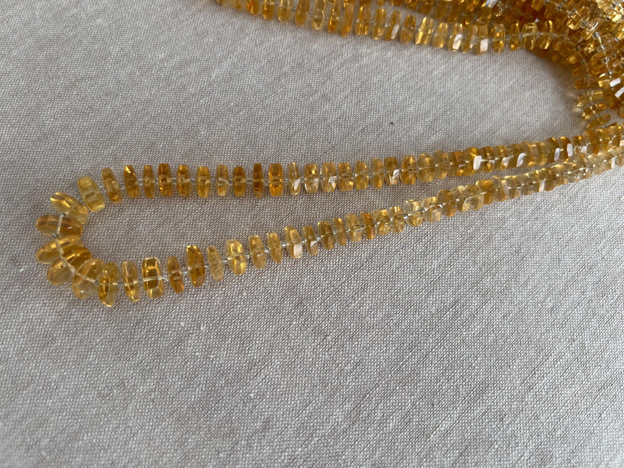16-inch strand of AAA Brazilian Citrine faceted bolt beads, approximately 80 gemstones graduated from 6mm to 13mm.