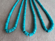 Close-up of Sleeping Beauty Turquoise heishi beads showing beautiful Arizona blue color and sparkling hand-faceted surfaces.