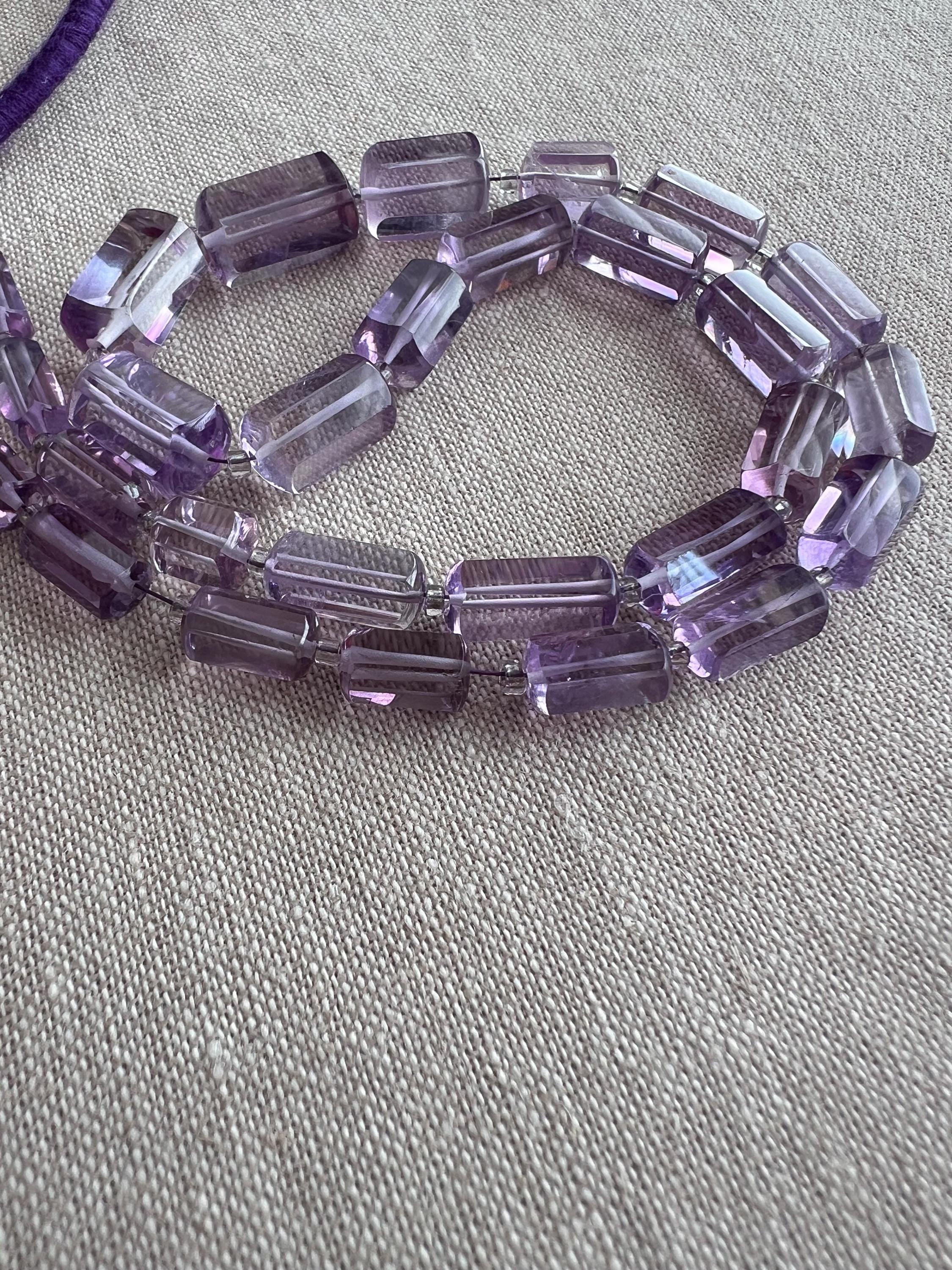 AAA Brazilian Amethyst faceted cylinder beads, transparent purple gemstones graduated from 5x10mm to 9x15mm for jewelry making.
