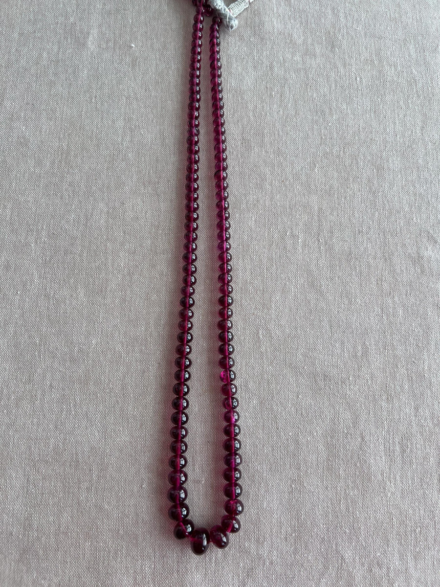 20-inch strand of AAA+ natural Rhodolite Garnet smooth rondelle beads, graduated from 6.5mm to 11mm for fine jewelry making.