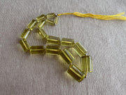 Rare oversized Lemon Quartz faceted cylinder beads, graduated up to 20x13mm, ideal for statement necklaces and custom jewelry designs.