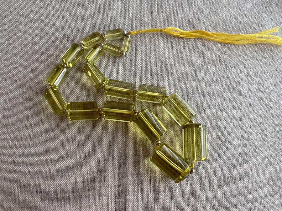 Rare oversized Lemon Quartz faceted cylinder beads, graduated up to 20x13mm, ideal for statement necklaces and custom jewelry designs.