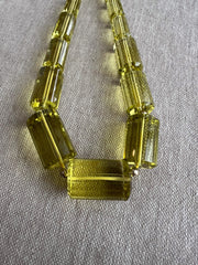 Large AAA++ Brazilian Lemon Quartz gemstone beads with precision faceted cylinder cuts and beautiful transparent yellow color.