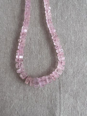 Brazilian Pink Morganite faceted cylinder and bolt-shaped beads featuring rich pink tones, translucent clarity, and polished facets.