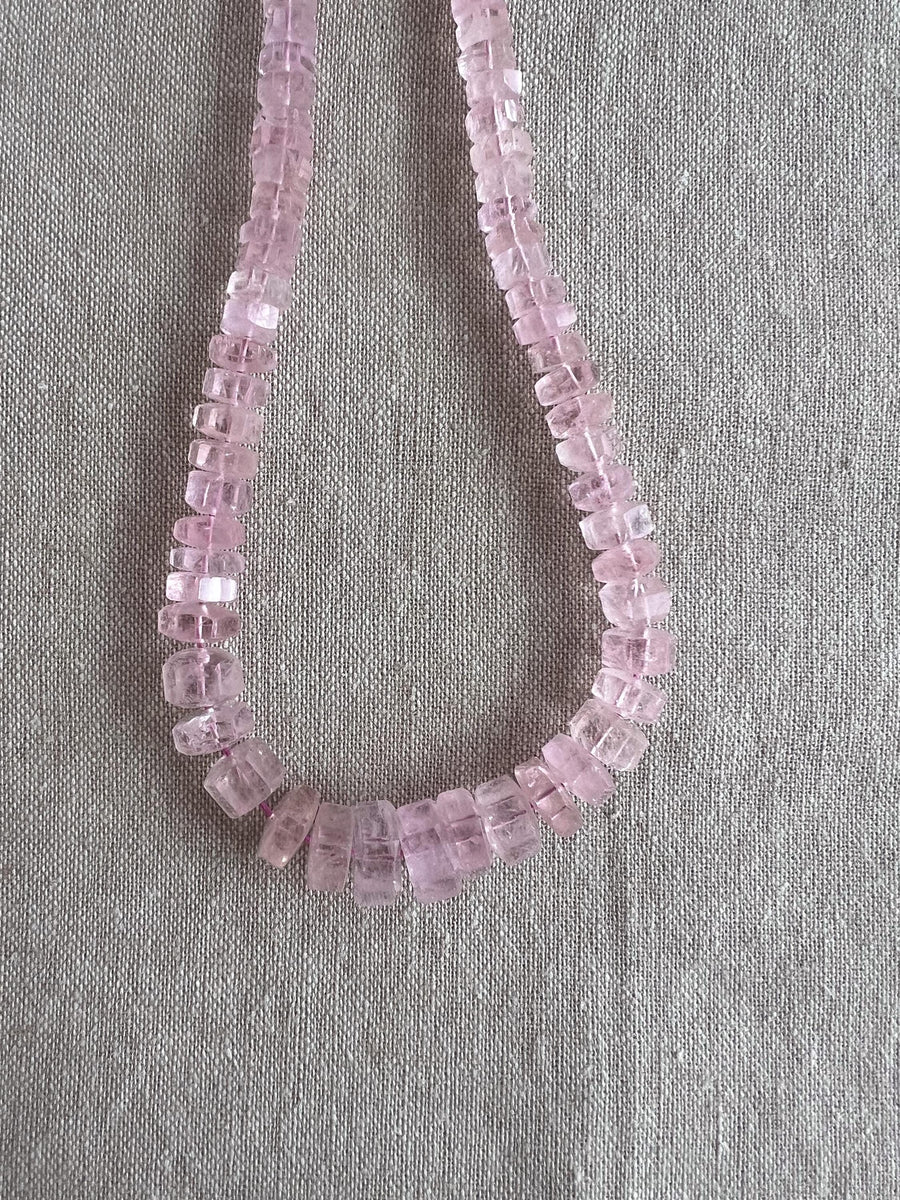 Brazilian Pink Morganite faceted cylinder and bolt-shaped beads featuring rich pink tones, translucent clarity, and polished facets.
