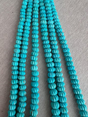 AA+ Sleeping Beauty Turquoise carved pumpkin beads with natural brown matrix and distinctive grooved surfaces for handmade gemstone jewelry.