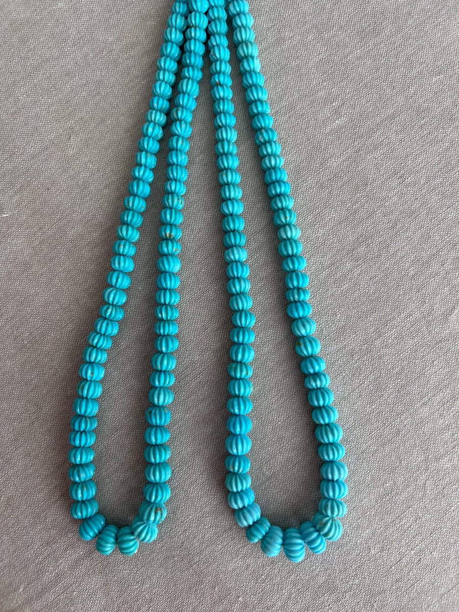 16-inch strand of AA+ Arizona Sleeping Beauty Turquoise carved melon beads, graduated from 5.5mm to 9mm for jewelry making.