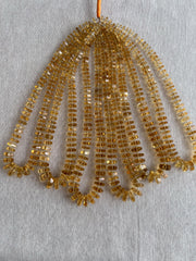 16-inch strand of AAA Brazilian Citrine faceted bolt beads, approximately 80 gemstones graduated from 6mm to 13mm.  multiple strands