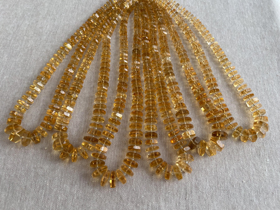 16-inch strand of AAA Brazilian Citrine faceted bolt beads, approximately 80 gemstones graduated from 6mm to 13mm. multiple strands