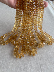 16-inch strand of AAA Brazilian Citrine faceted bolt beads, approximately 80 gemstones graduated from 6mm to 13mm. multiple strands