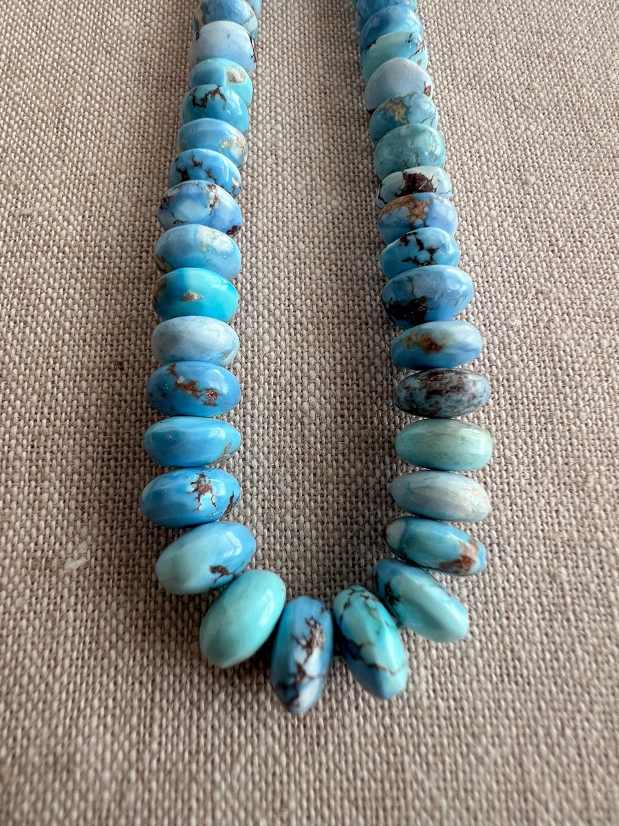 Natural untreated Golden Hills Turquoise rondelle beads featuring lavender blue gemstones with beautiful chocolate brown matrix patterns.
