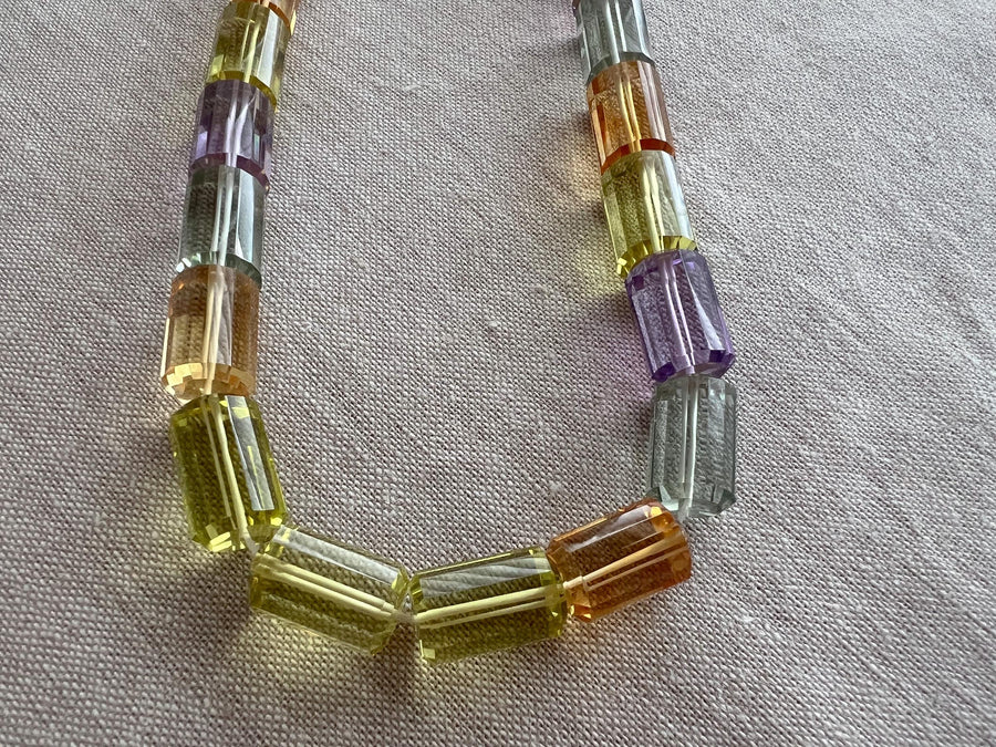 Faceted Amethyst, green Prasiolite, golden Citrine, and yellow Lemon Quartz cylinder beads in a vibrant multi-color gemstone mix.