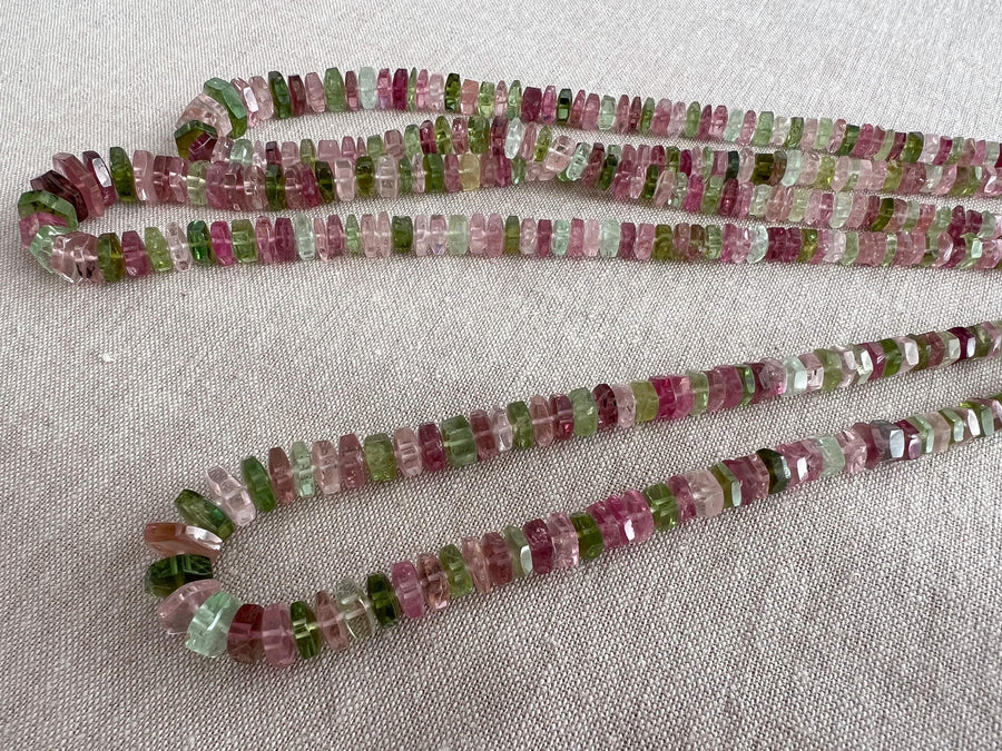 Strand of natural untreated Tourmaline faceted bolt beads in graduated sizes, ideal for fine jewelry making.