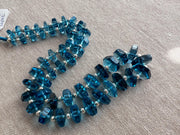 AAA+ Swiss Blue Topaz bolt cut beads featuring uniform vivid blue color, transparent clarity, and distinctive faceted shapes.