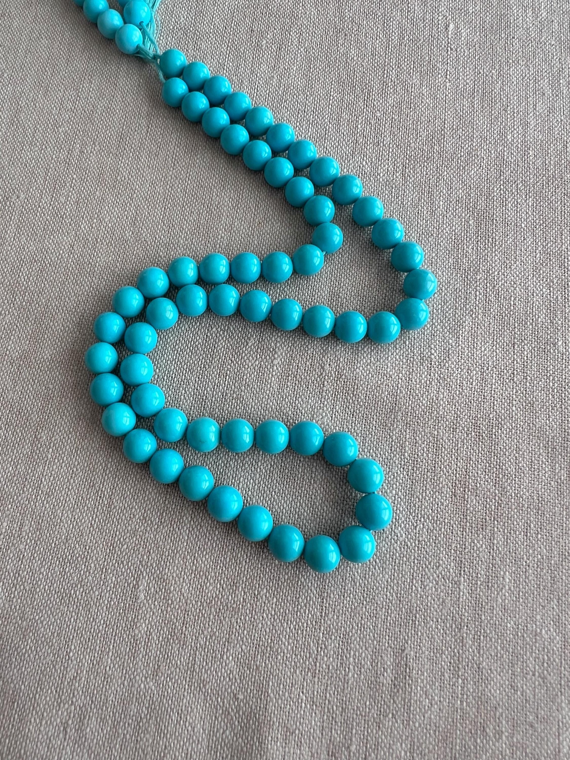 AAA+ Sleeping Beauty Turquoise smooth round beads, 7mm natural Arizona gemstones in classic robin's egg blue.