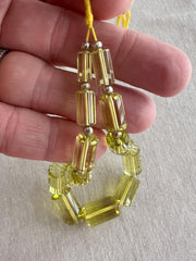 Large AAA++ Brazilian Lemon Quartz gemstone beads with precision faceted cylinder cuts and beautiful transparent yellow color.