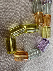 AAA++ multi gemstone faceted cylinder beads featuring Amethyst, Citrine, Prasiolite, and Lemon Quartz for fine jewelry making.