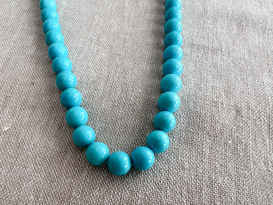 Natural Arizona Sleeping Beauty Turquoise round gemstone beads, 7mm, with exceptional blue color and clean polished surfaces.