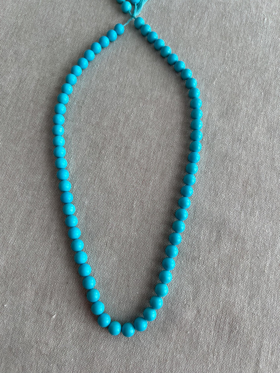 16-inch strand of AAA+ Sleeping Beauty Turquoise smooth round 7mm beads from Arizona for fine jewelry making.