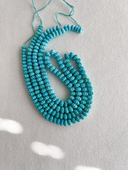 AA+ natural Sleeping Beauty Turquoise carved melon beads from Arizona, featuring classic robin's egg blue color and brown matrix.