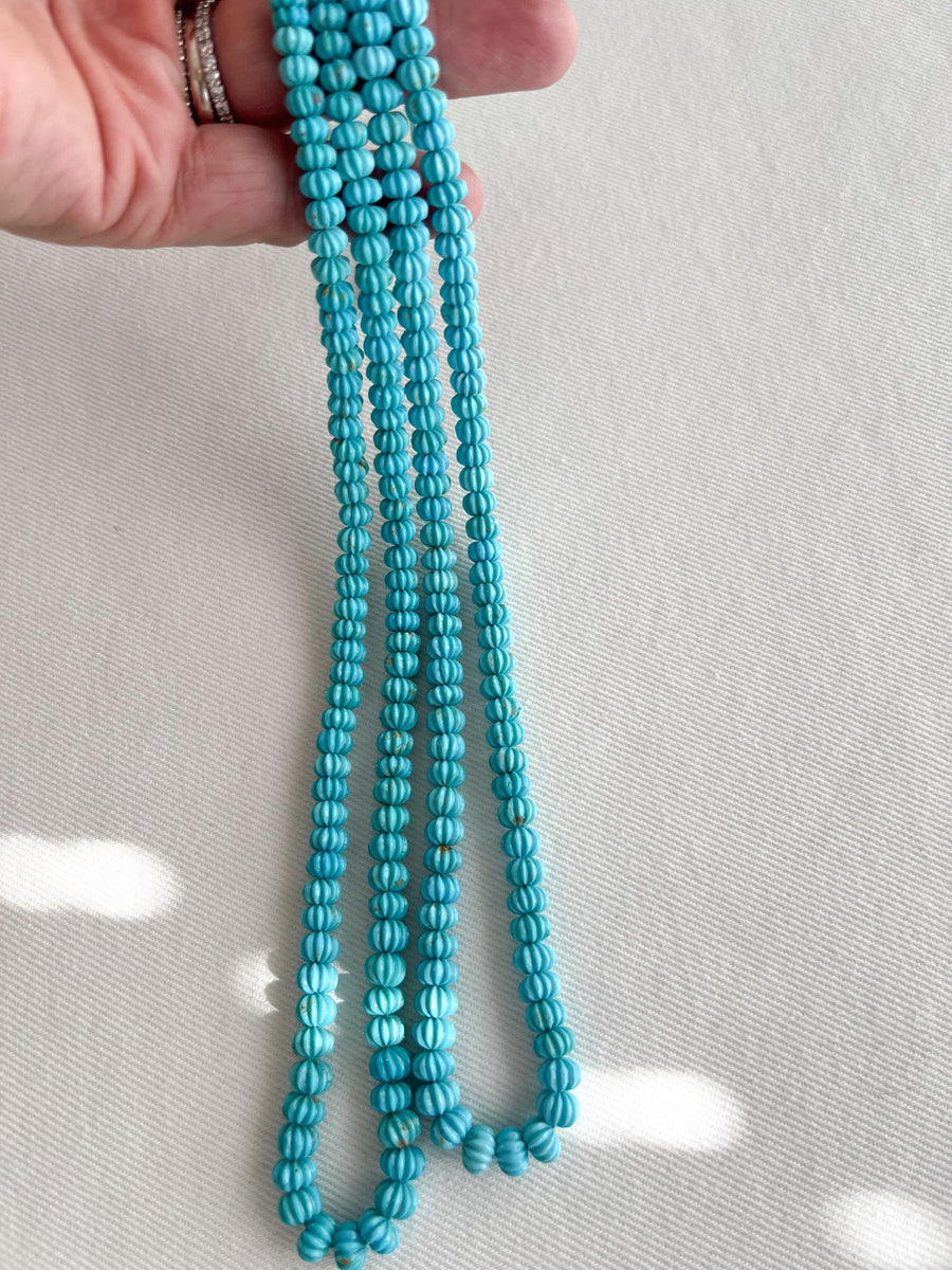 16-inch strand of AA+ Arizona Sleeping Beauty Turquoise carved melon beads, graduated from 5.5mm to 9mm for jewelry making.