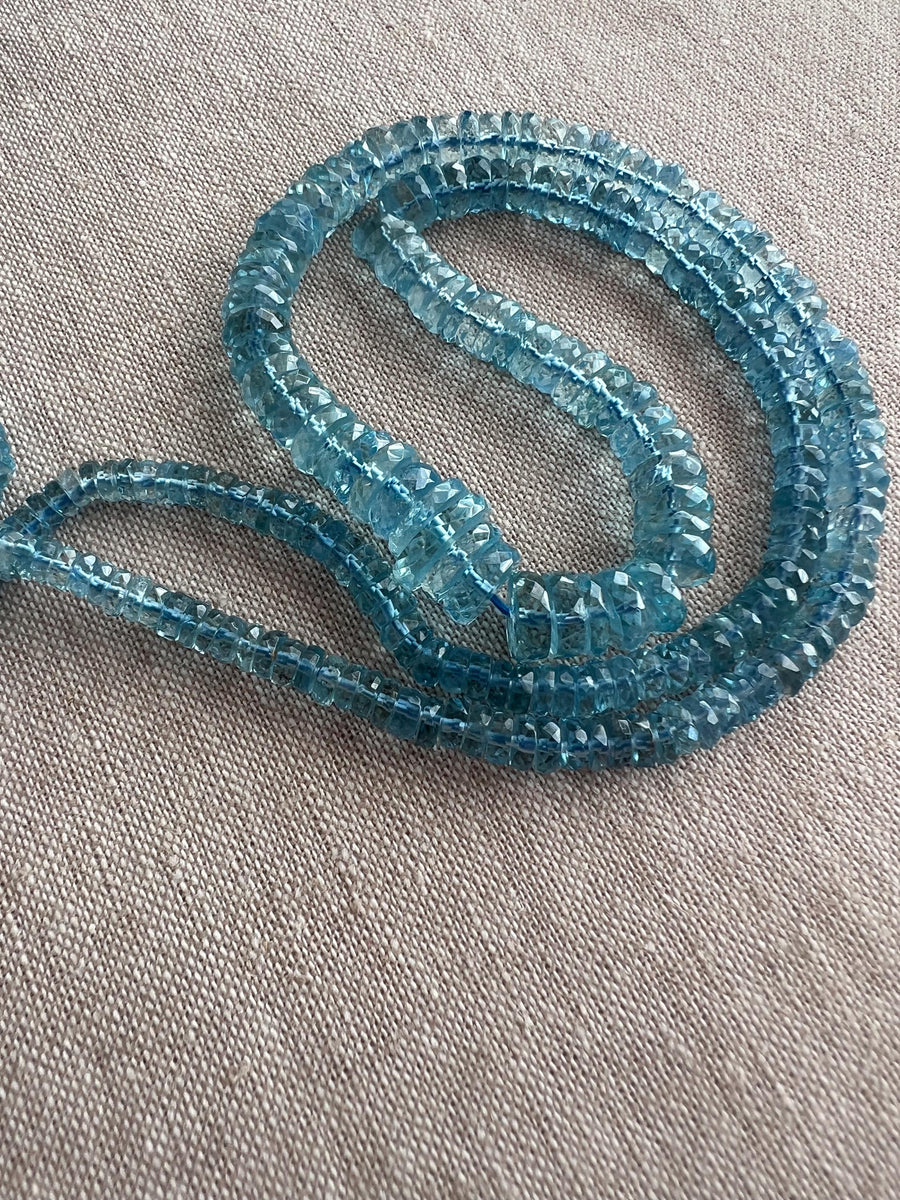 Strand of natural Santa Maria Aquamarine faceted tyre beads, graduated from 4mm to 9.5mm, for jewelry making.