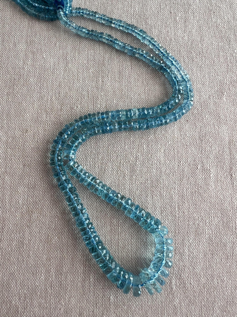 Gem Grade Santa Maria Aquamarine faceted tyre beads, natural deep blue Brazilian gemstones for fine jewelry making.
