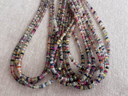 16-inch strand of natural unheated Sapphire faceted rondelle beads in assorted colors, graduated from 2.5mm to 4mm. multiple strand close up