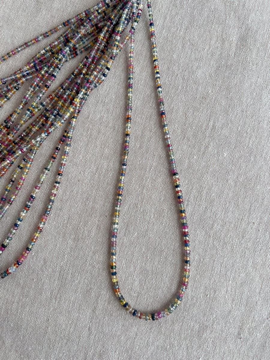16-inch strand of natural unheated Sapphire faceted rondelle beads in assorted colors, graduated from 2.5mm to 4mm.