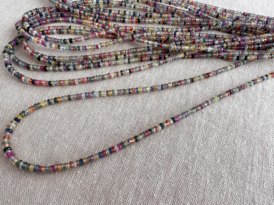 16-inch strand of natural unheated Sapphire faceted rondelle beads in assorted colors, graduated from 2.5mm to 4mm.