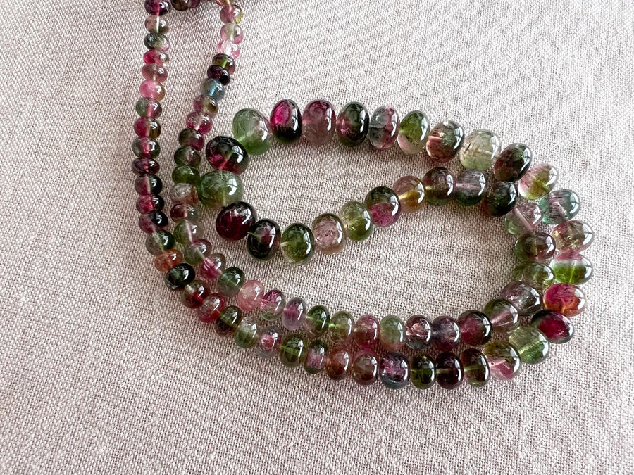 AAA-grade natural bi-color tourmaline smooth rondelle gemstone beads, graduated from 5.5mm to 11mm, featuring beautiful natural color variations for jewelry making.