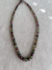 AAA-grade natural bi-color tourmaline smooth rondelle gemstone beads, graduated from 5.5mm to 11mm, featuring beautiful natural color variations for jewelry making. full strand
