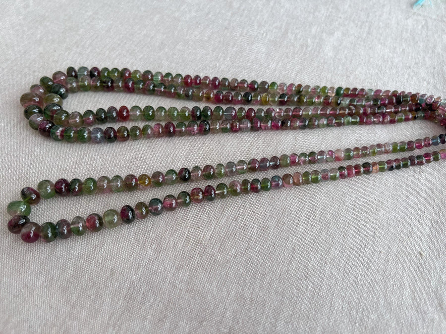 AAA-grade natural bi-color tourmaline smooth rondelle gemstone beads, graduated from 5.5mm to 11mm, featuring beautiful natural color variations for jewelry making. full strand