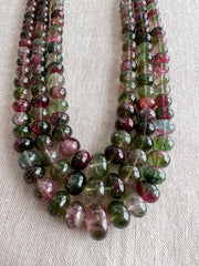 AAA-grade natural bi-color tourmaline smooth rondelle gemstone beads, graduated from 5.5mm to 11mm, featuring beautiful natural color variations for jewelry making. 3 strands close up image