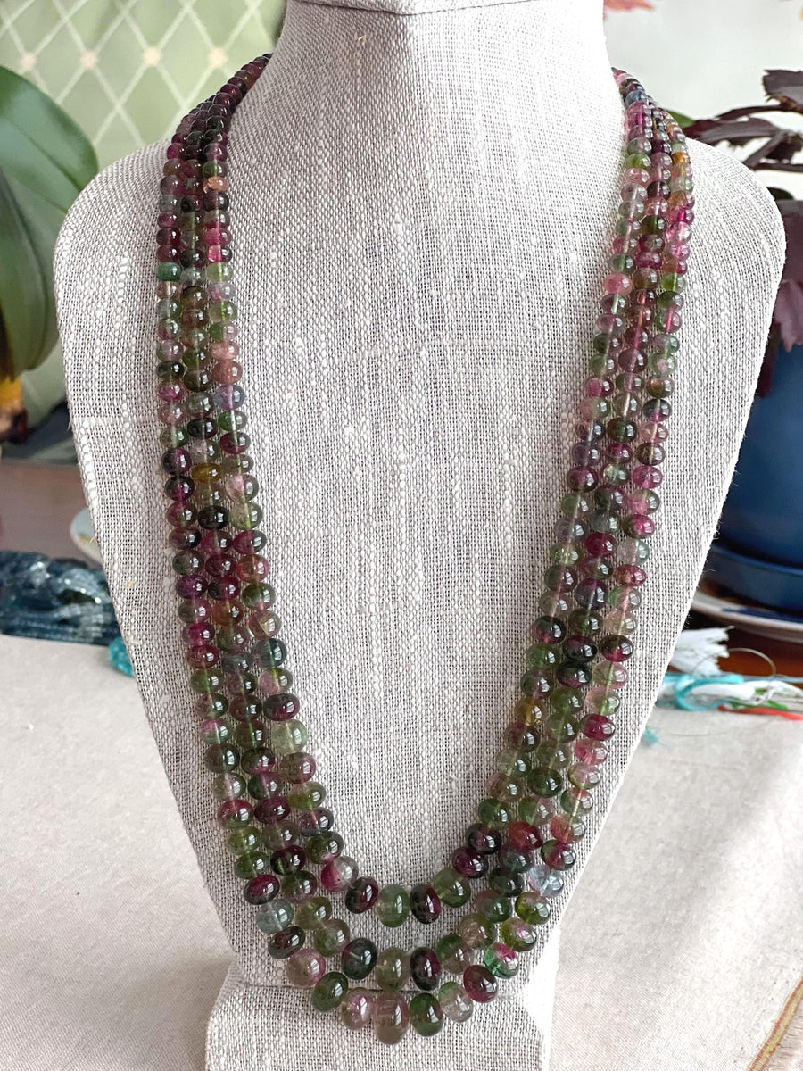 AAA-grade natural bi-color tourmaline smooth rondelle gemstone beads, graduated from 5.5mm to 11mm, featuring beautiful natural color variations for jewelry making. 3 strands on a bust