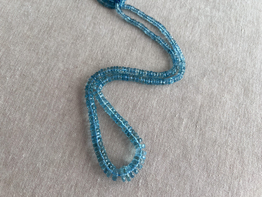Strand of natural Santa Maria Aquamarine faceted tyre beads, graduated from 4mm to 9.5mm, for jewelry making.