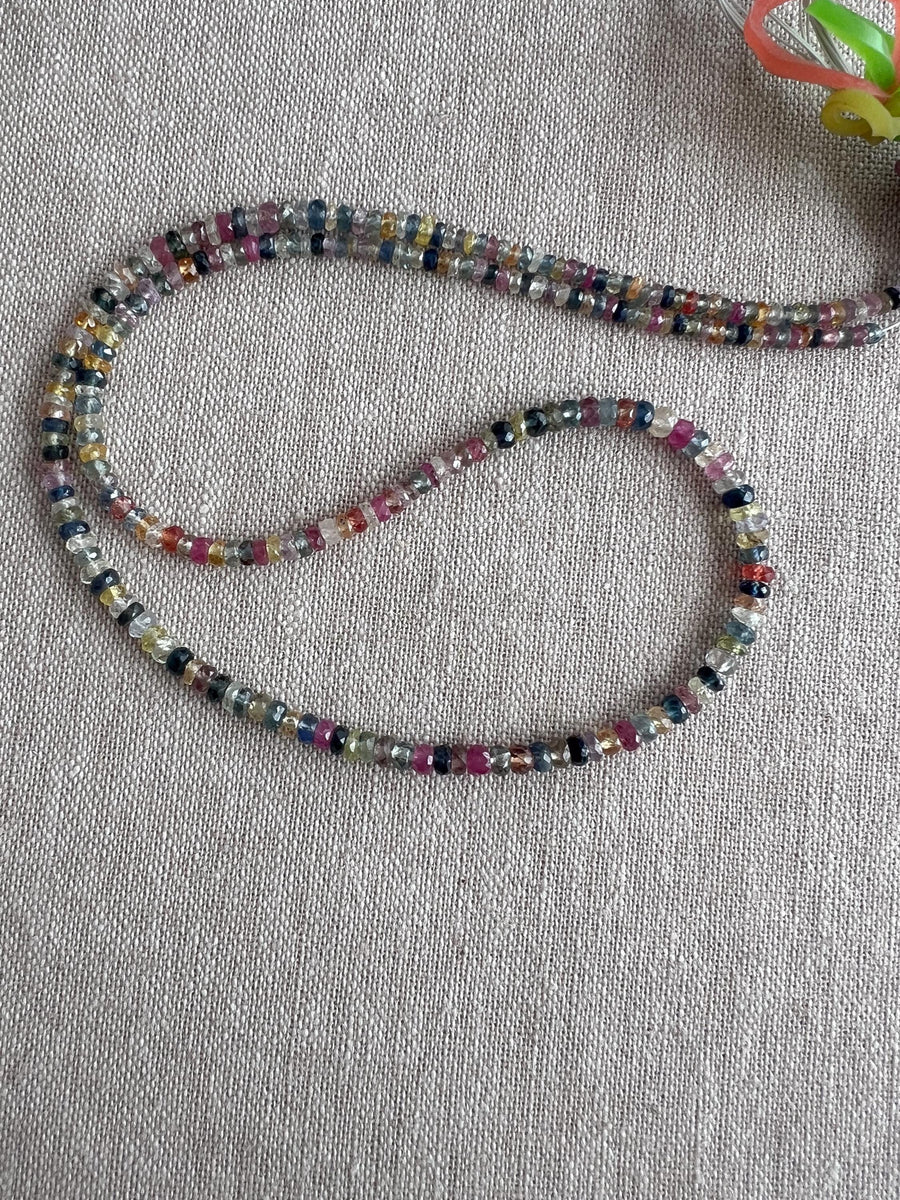 16-inch strand of natural unheated Sapphire faceted rondelle beads in assorted colors, graduated from 2.5mm to 4mm.